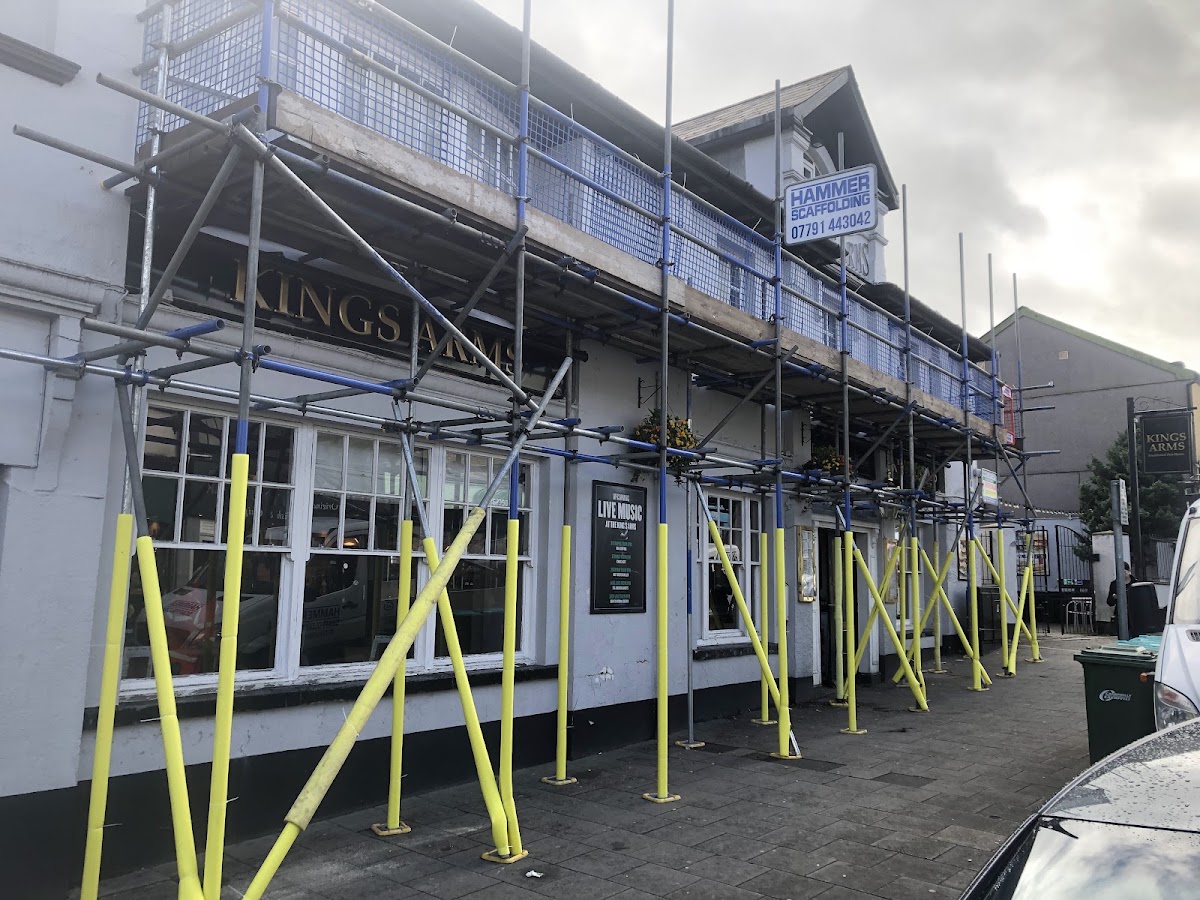 High street pub frontage, two lifts over the pavement
